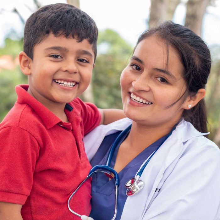 portrait-of-a-happy-child-being-held-by-his-pediat-2023-11-27-05-30-31-utc